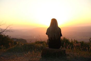 person imaging on a mountain top