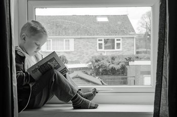 student reading in the window