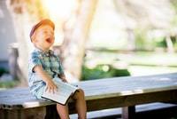 boy laughing at what he read