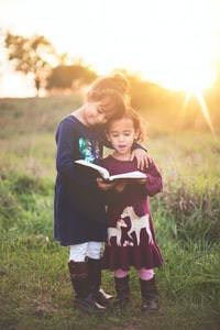 children enjoying their book