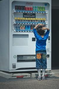 child at a vending machine