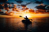 person in a kayak in a remote area